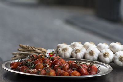 Close-up of fruits in container on table