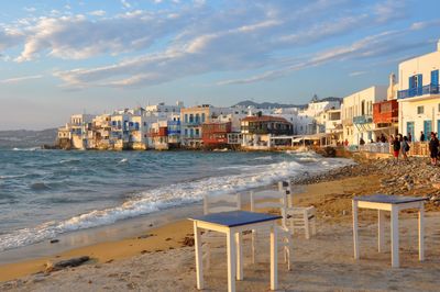 Scenic view of beach by sea against sky