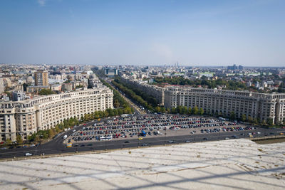 High angle view of city buildings against sky