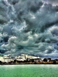 Scenic view of sea against cloudy sky