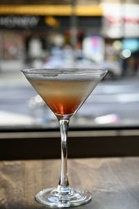 Close-up of cocktail in glass on table