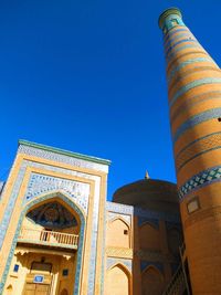 Low angle view of tower against clear blue sky