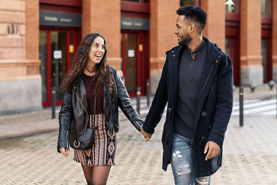 Young couple walking outdoors