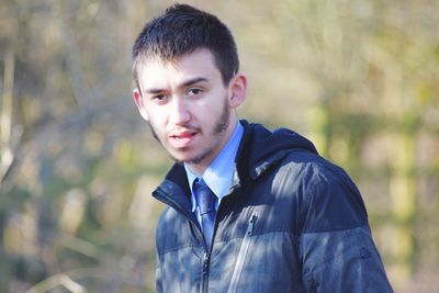 Portrait of smiling young man outdoors