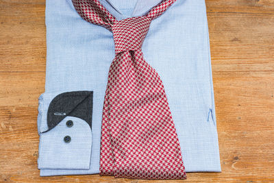 Close-up of necktie on shirt at table