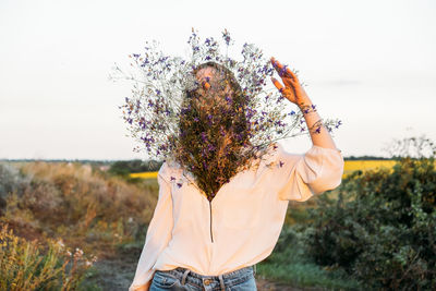 Healing power of nature, benefits of ecotherapy, nature impact wellbeing. happy young girl holding