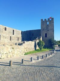 Exterior of fort against clear blue sky