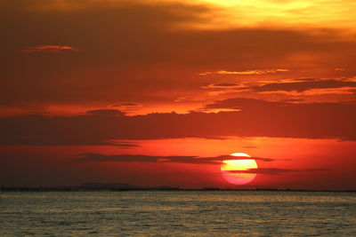 Scenic view of sea against romantic sky at sunset