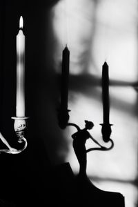 Shadow of candle on wall