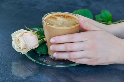 Close-up of woman holding drink