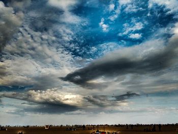 Scenic view of landscape against cloudy sky