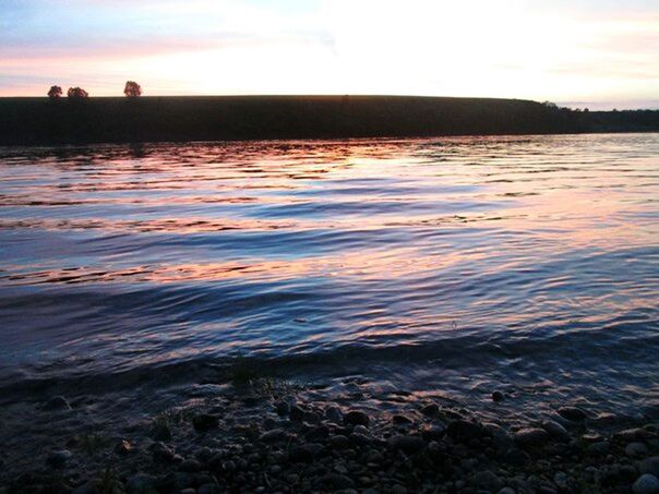 water, sunset, tranquil scene, scenics, sky, tranquility, beauty in nature, sea, rippled, nature, silhouette, idyllic, reflection, lake, dusk, waterfront, cloud - sky, remote, rock - object, outdoors