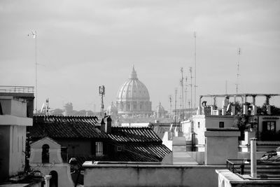 St peters basilica in far distance, with rome roof tops 