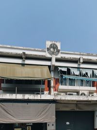 Low angle view of building against clear blue sky