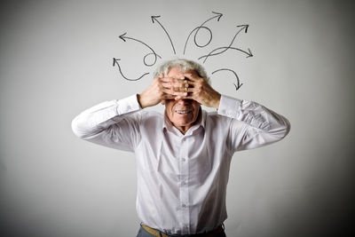 Portrait of man wearing mask against white background