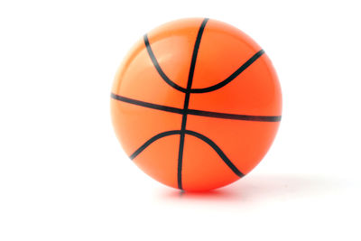 Close-up of orange ball against white background