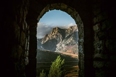 Buildings seen through arch window