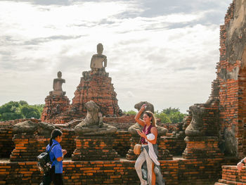 Statue of historic building against sky