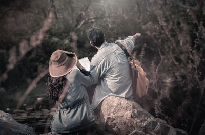 Rear view of man on rock