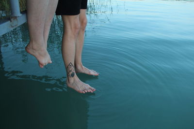 Low section of woman in water