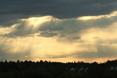 Scenic view of landscape against cloudy sky