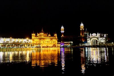 View of illuminated buildings at waterfront