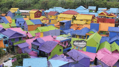 High angle view of multi colored houses by building