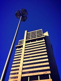 Low angle view of building against clear blue sky