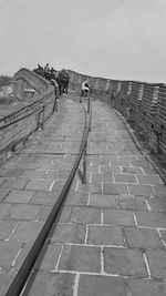 Cobblestone street against clear sky