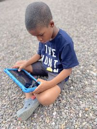 My grandson playing games on his tablet