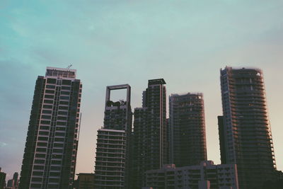 Low angle view of modern buildings against sky