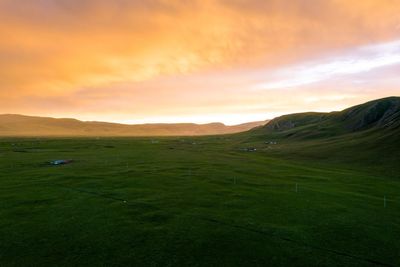 Scenic view of landscape against sky during sunset