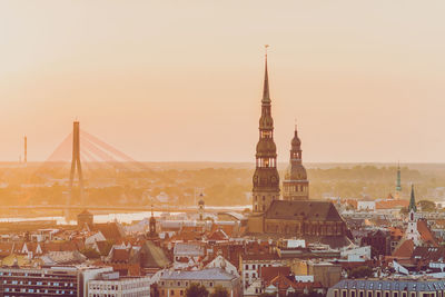 Cityscape against sky during sunset