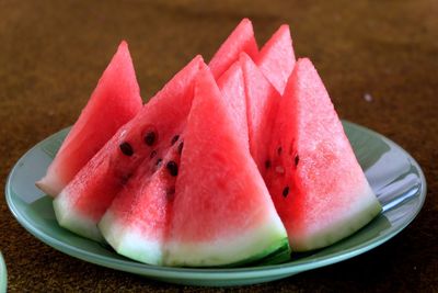 Close-up of fruits in plate on table