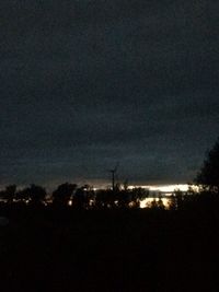 Scenic view of landscape against sky at night