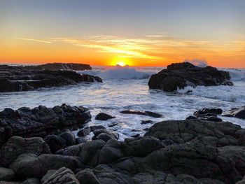 Scenic view of sea against sky during sunset