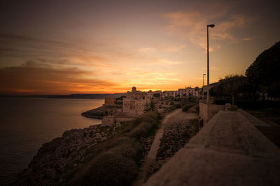 Scenic view of beach against sky during sunset