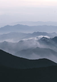 Scenic view of silhouette mountains against sky