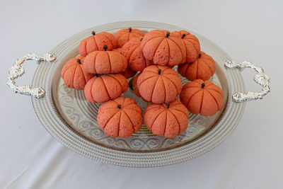 High angle view of pumpkins in plate on table