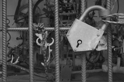 Close-up of padlocks hanging on rope