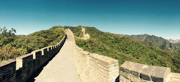 Ruins of temple against clear blue sky