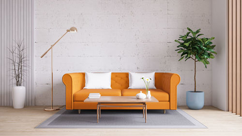 Empty chairs and table against wall at home