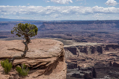 Scenic view of landscape against cloudy sky