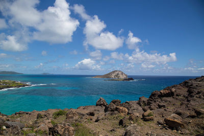 Scenic view of sea against blue sky