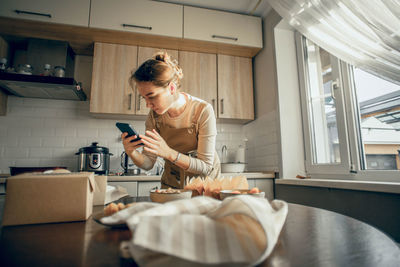 Food blogger shoots chocolate muffins on phone, content for social networks, photos and videos