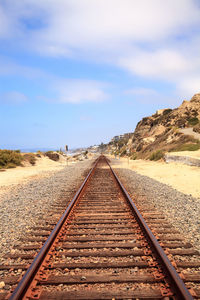 Railroad tracks against sky