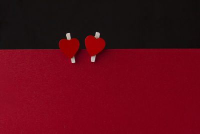 High angle view of red toy on table against black background