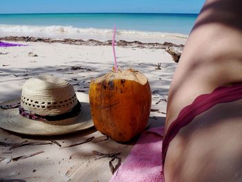 Midsection of woman on beach