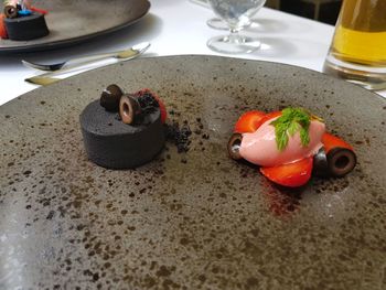 High angle view of fruits in plate on table