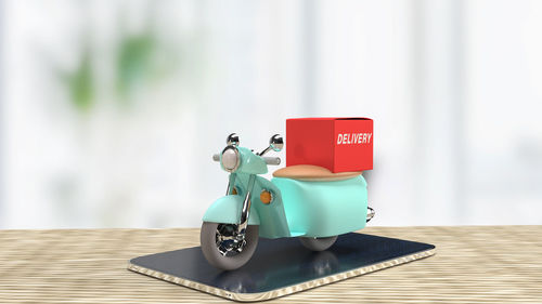 Close-up of toy car on table against wall